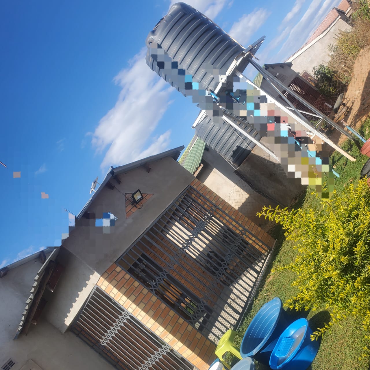 Charlton Park Gweru house exterior with water tanks